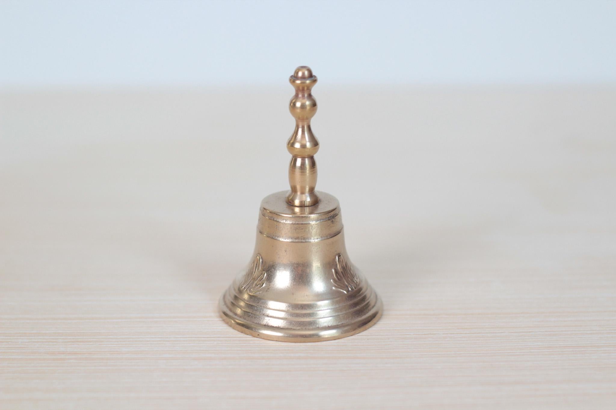 Vintage Midcentury Brass Hand Bell with Raised Floral Motif