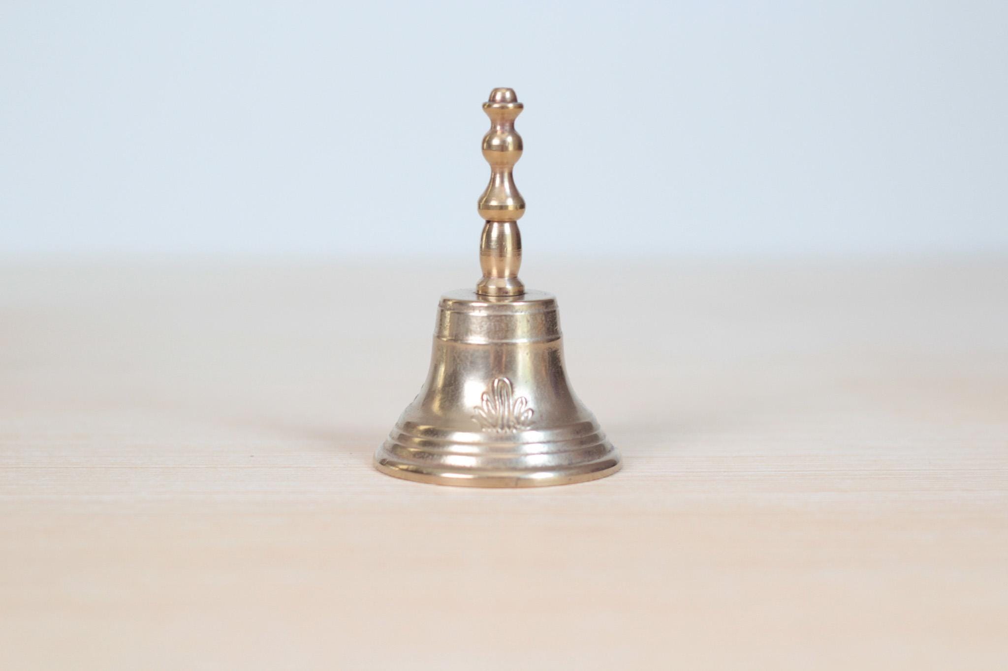 Vintage Midcentury Brass Hand Bell with Raised Floral Motif