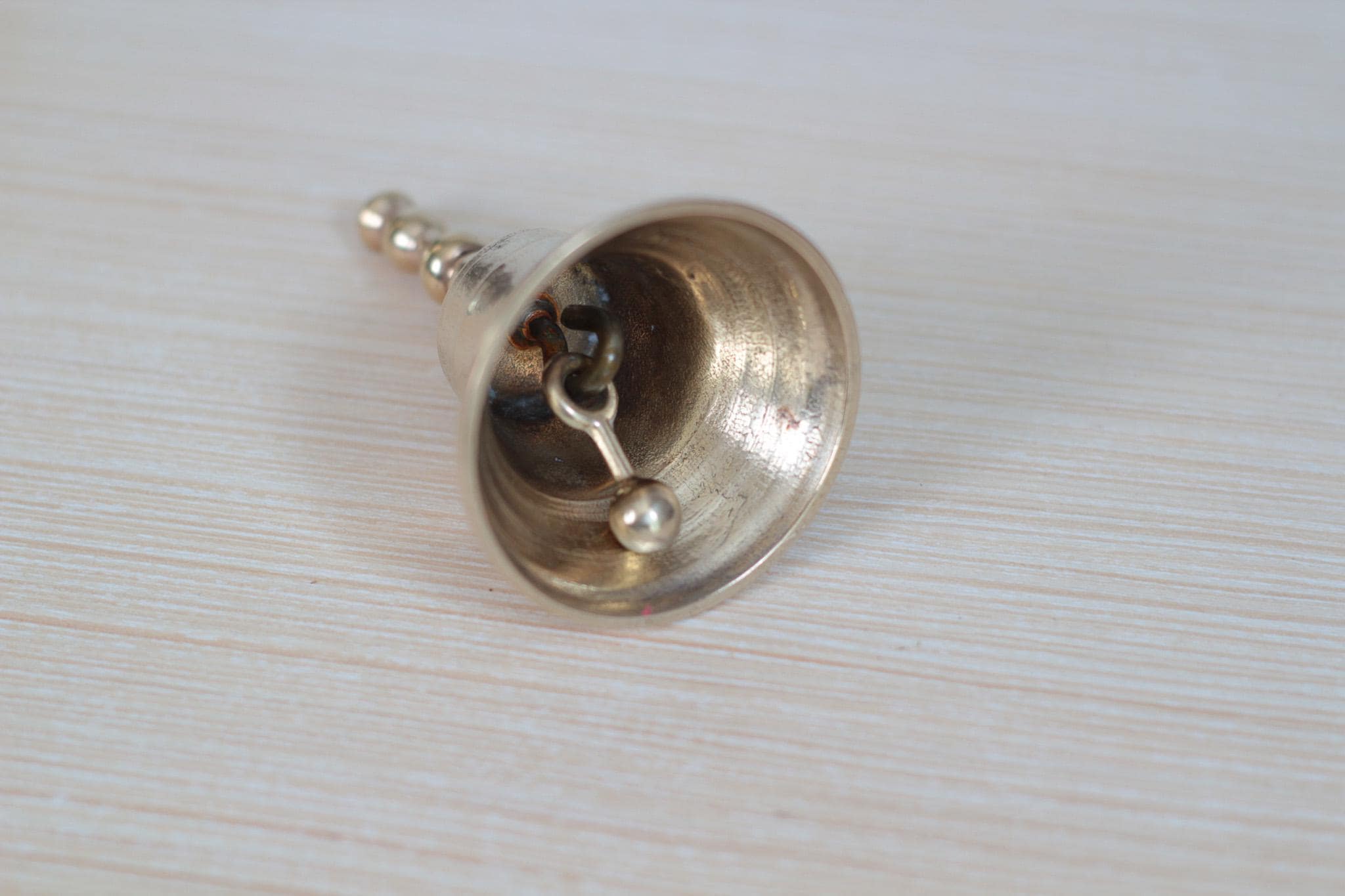 Vintage Midcentury Brass Hand Bell with Raised Floral Motif