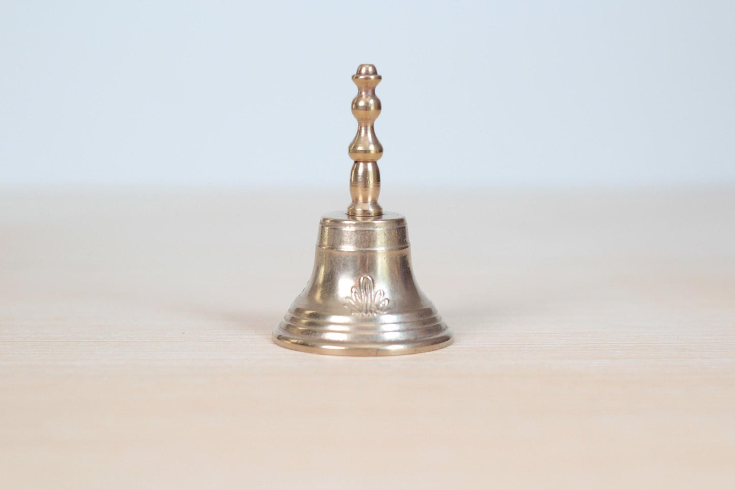 Vintage Midcentury Brass Hand Bell with Raised Floral Motif