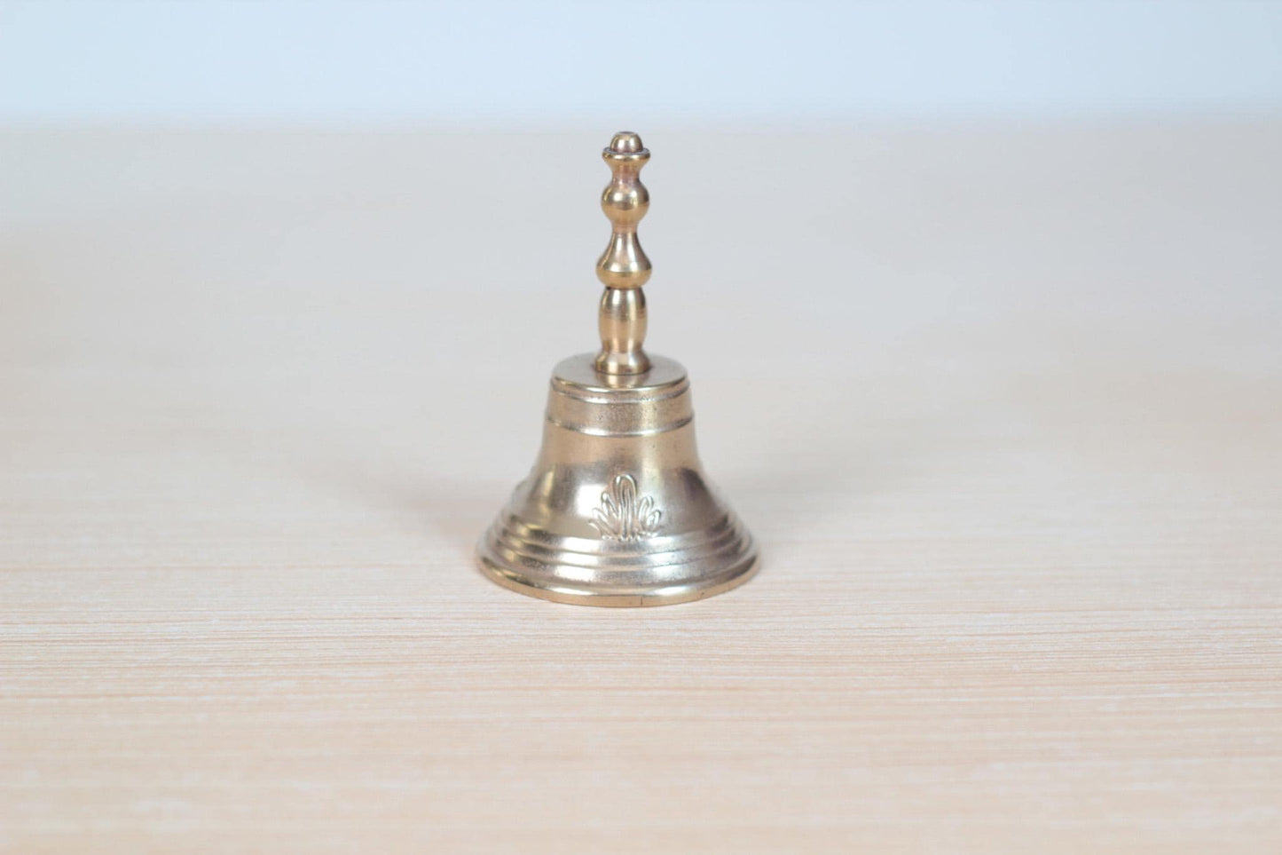 Vintage Midcentury Brass Hand Bell with Raised Floral Motif